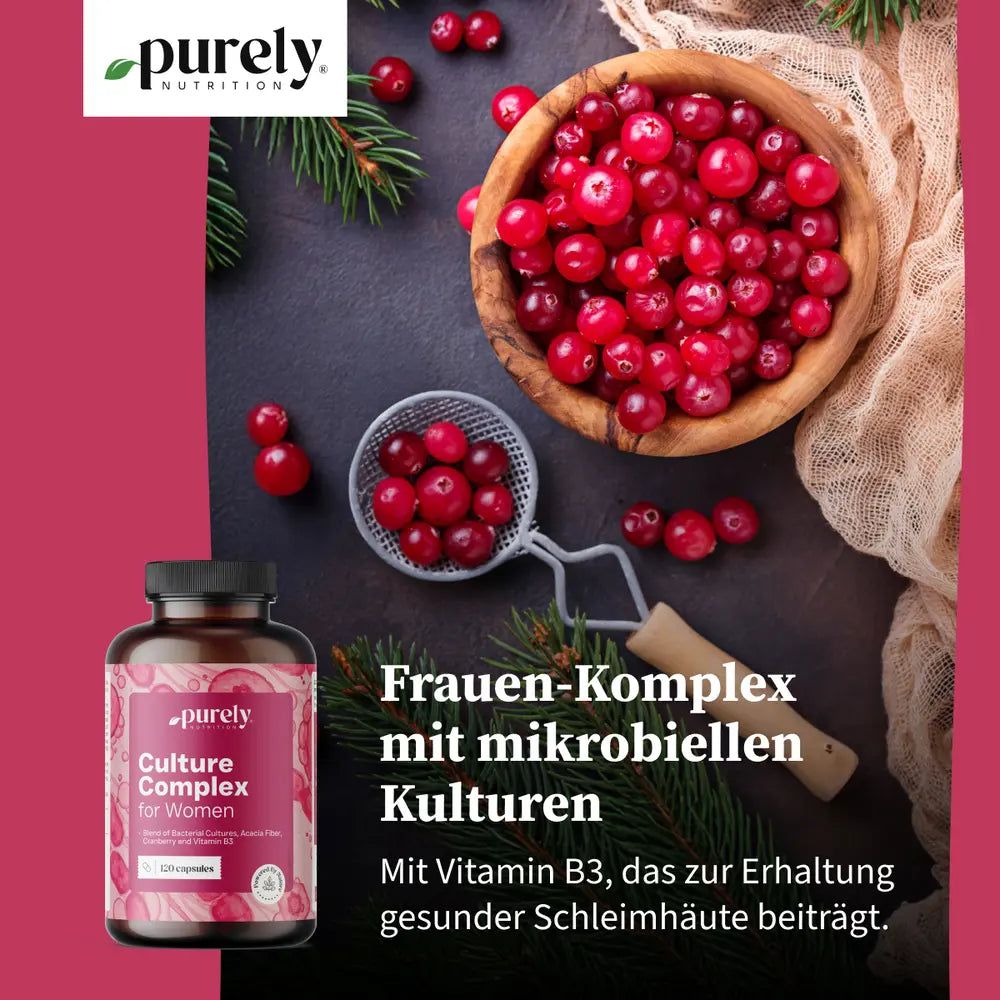 Flasche mit Kapseln neben Cranberries. Text: Frauen-Komplex mit mikrobiellen Kulturen. Mit Vitamin B3.