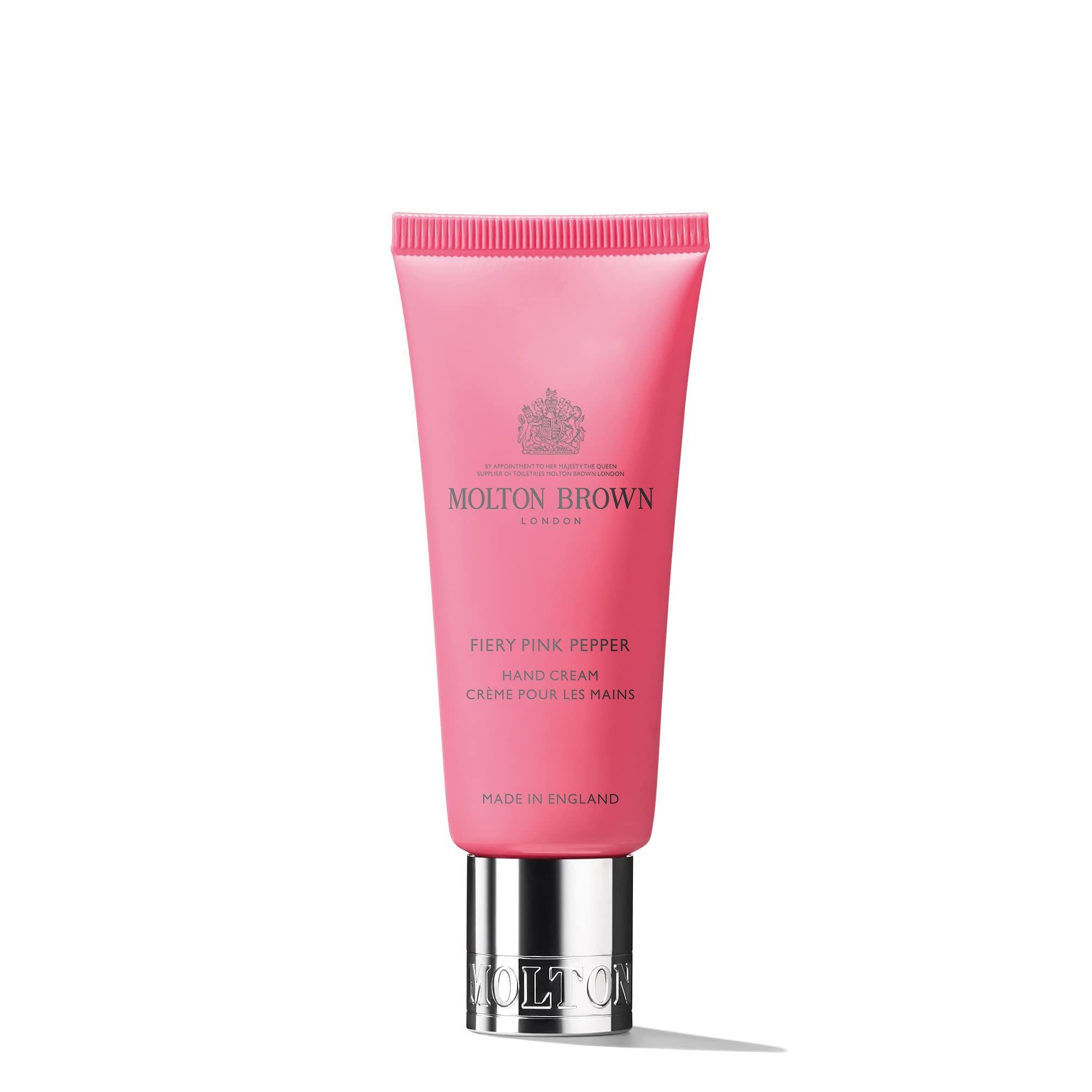 Eine rosa Tube Handcreme mit silbernem Verschluss und dem Molton Brown Logo.