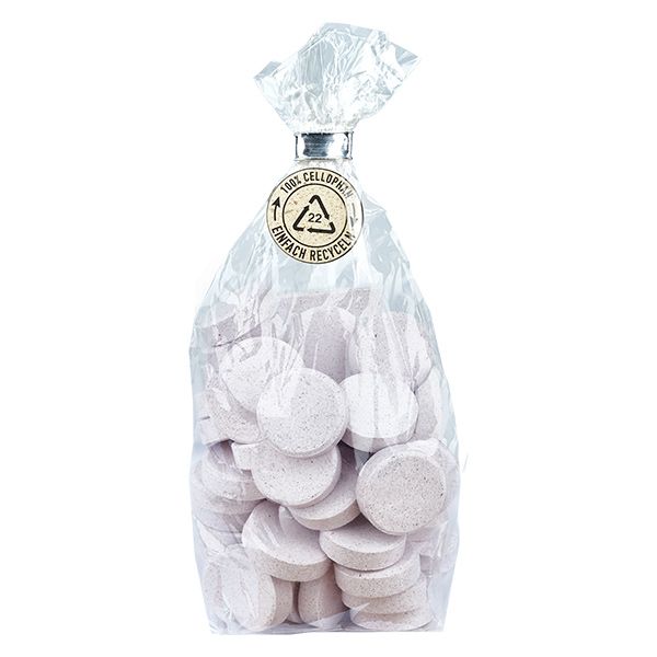 Beutel mit Tabletten. Tabletten rund, hell. Verpackung transparent, mit Siegel und Aufdruck.