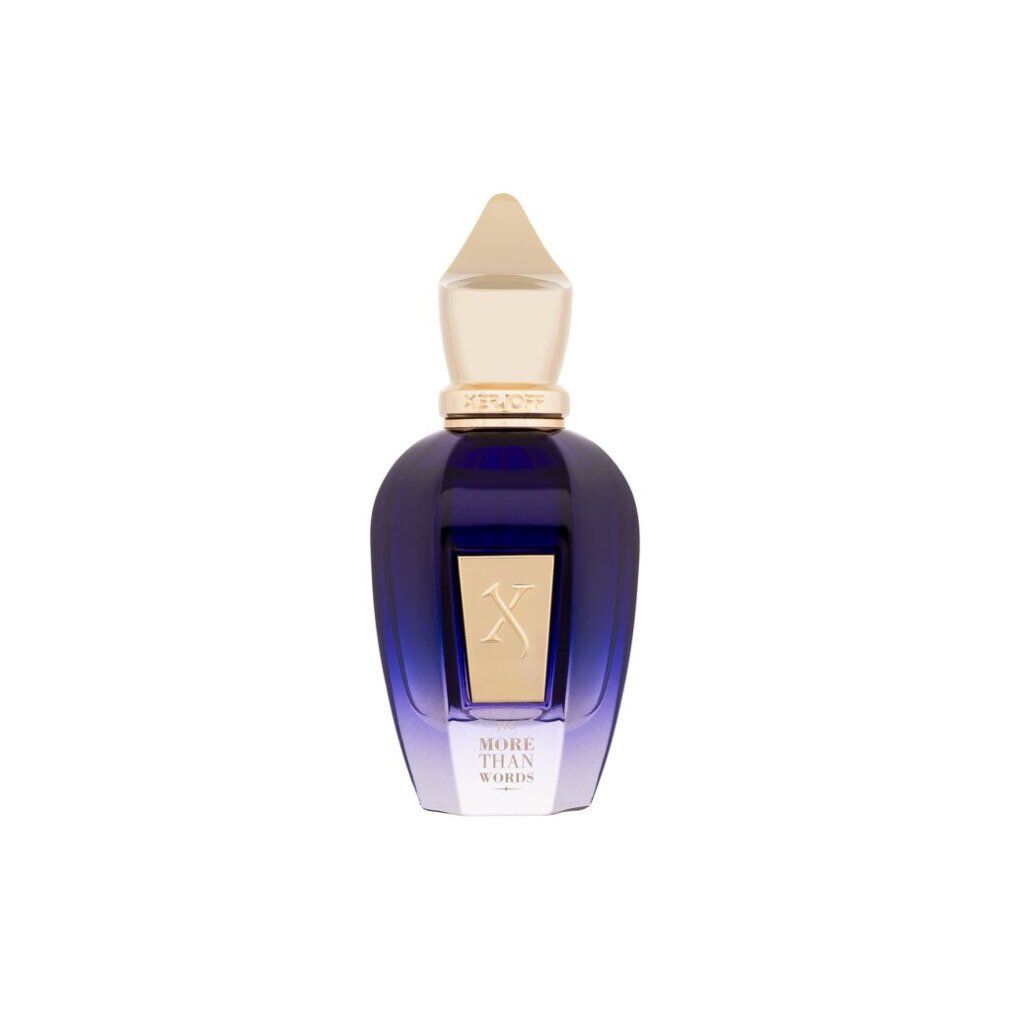 Blau-transparente Flasche mit goldenem Verschluss. Aufschrift "MORE THAN WORDS". Goldfarbenes "X"-Logo.