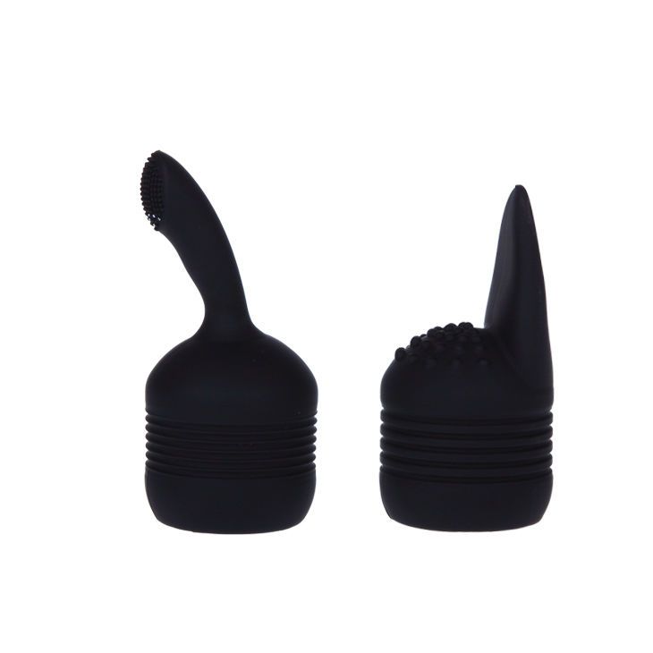 Zwei schwarze Aufsätze. Einer mit Borsten, einer konisch mit Noppen. Beide mit geriffelten Basen.