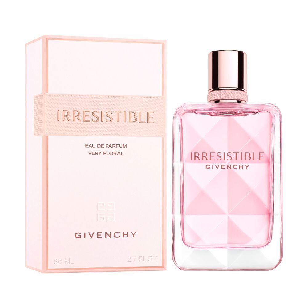 Rosa Parfumflasche und Verpackung. Aufschrift: Irresistible, Eau de Parfum Very Floral, Givenchy. Rechteckige Flasche mit rosa Inhalt.