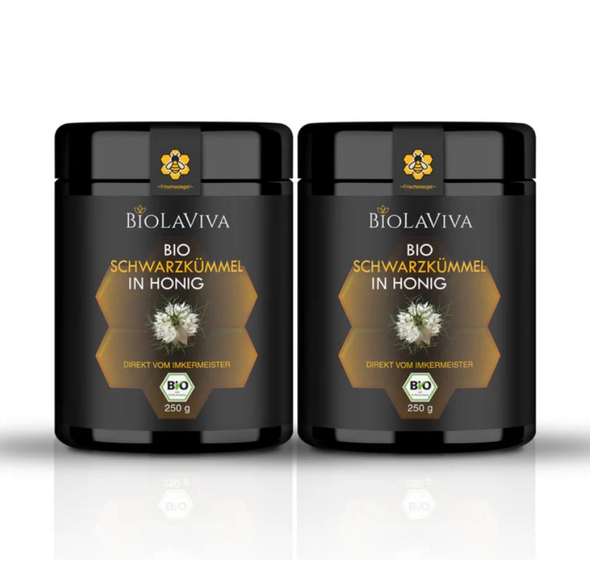 Zwei schwarze Dosen mit BIOLAVIVA BIO-Schwarzkümmel in Honig. Aufschrift: BIO, 250 g. Honigwabe-Design.
