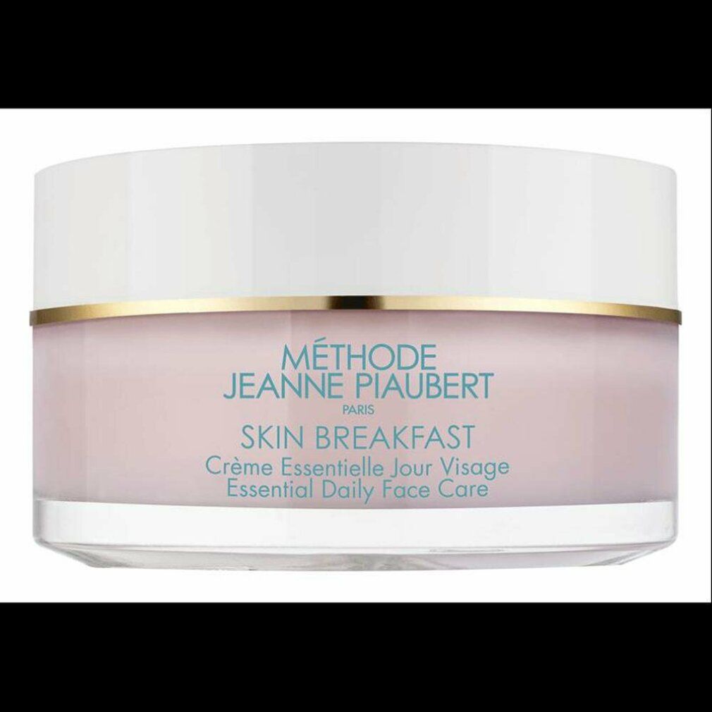 Creme-Tiegel mit weißem Deckel und rosa Inhalt. Goldener Ring. Schriftzug SKIN BREAKFAST.