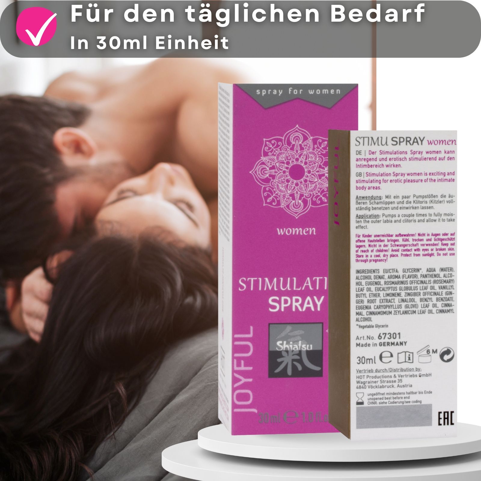 Verpackung und Flasche. Text: Stimulation Spray, Shiatsu. Paar im Hintergrund.
