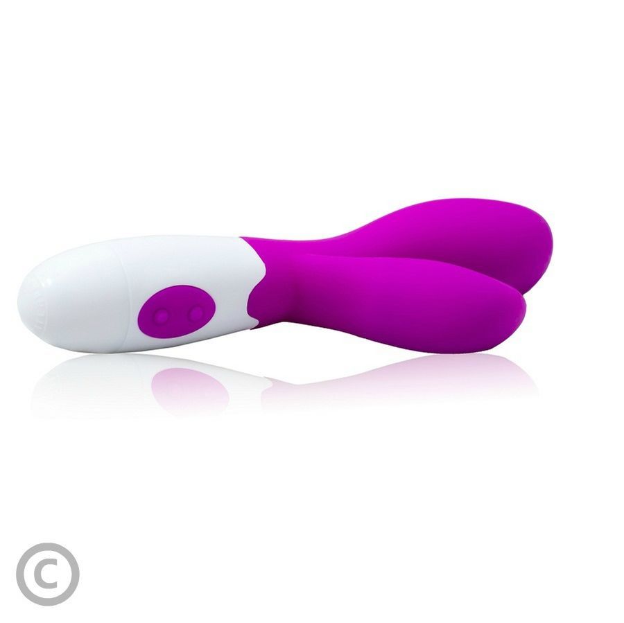 Lila und weißer Vibrator, liegend auf einer spiegelnden Oberfläche.