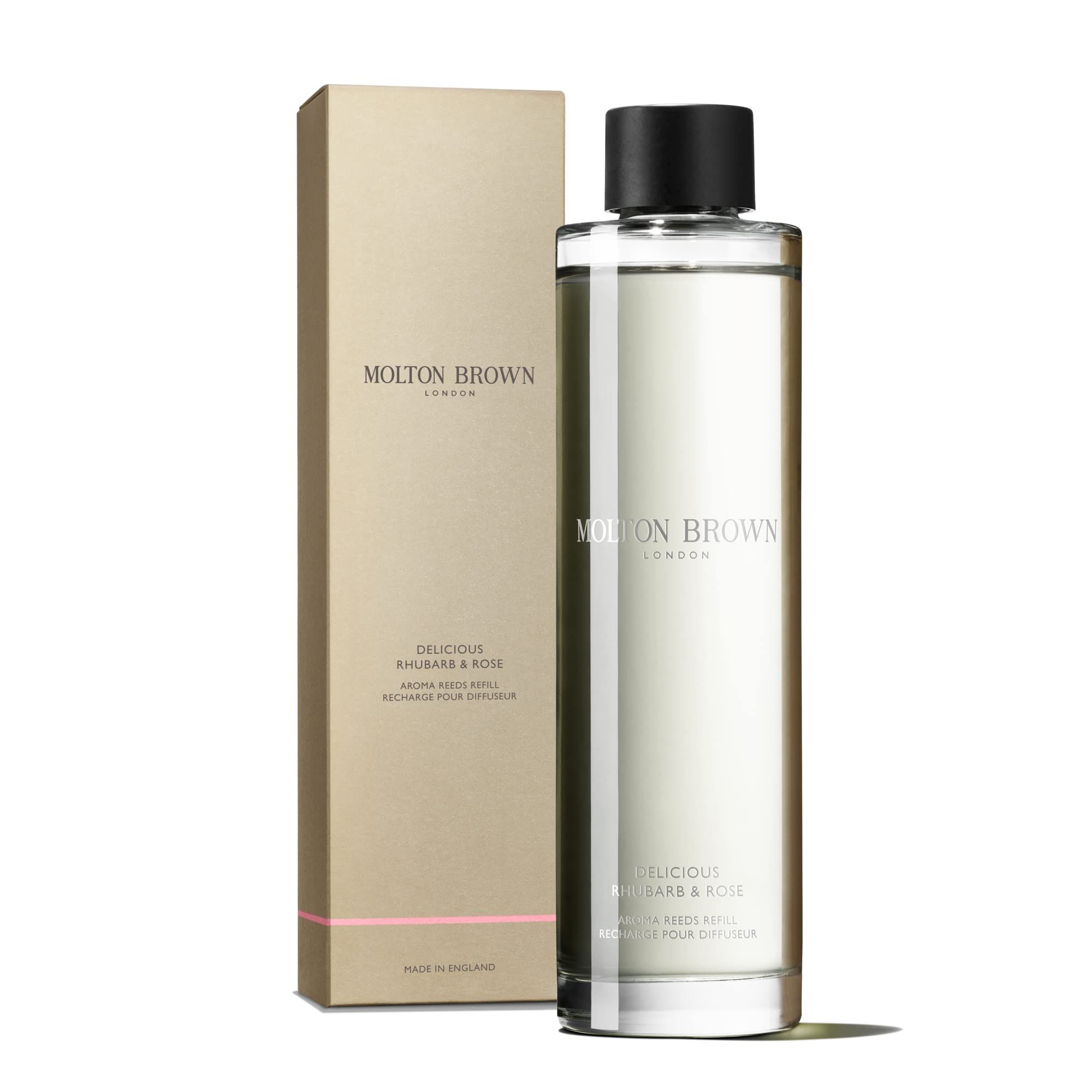 Molton Brown Rhubarb & Rose Aroma-Nachfüllung in Glasflasche mit schwarzem Deckel, daneben die Verpackung.