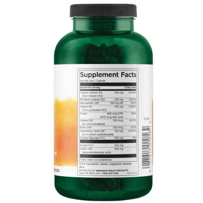 Rückseite einer grünen Flasche. Weißes Etikett mit Nährwertangaben. Enthält Vitamin B-Komplex. Zutatenliste und Herstellerinformationen.