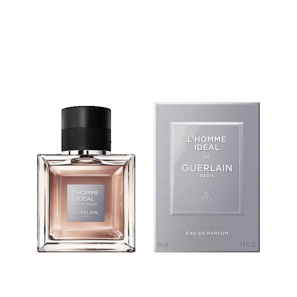 Guerlain L'Homme Ideal Eau de Parfum Flakon und Verpackung. Quadratischer Flakon, schwarzer Deckel, hellbraune Flüssigkeit. Verpackung mit Logo.