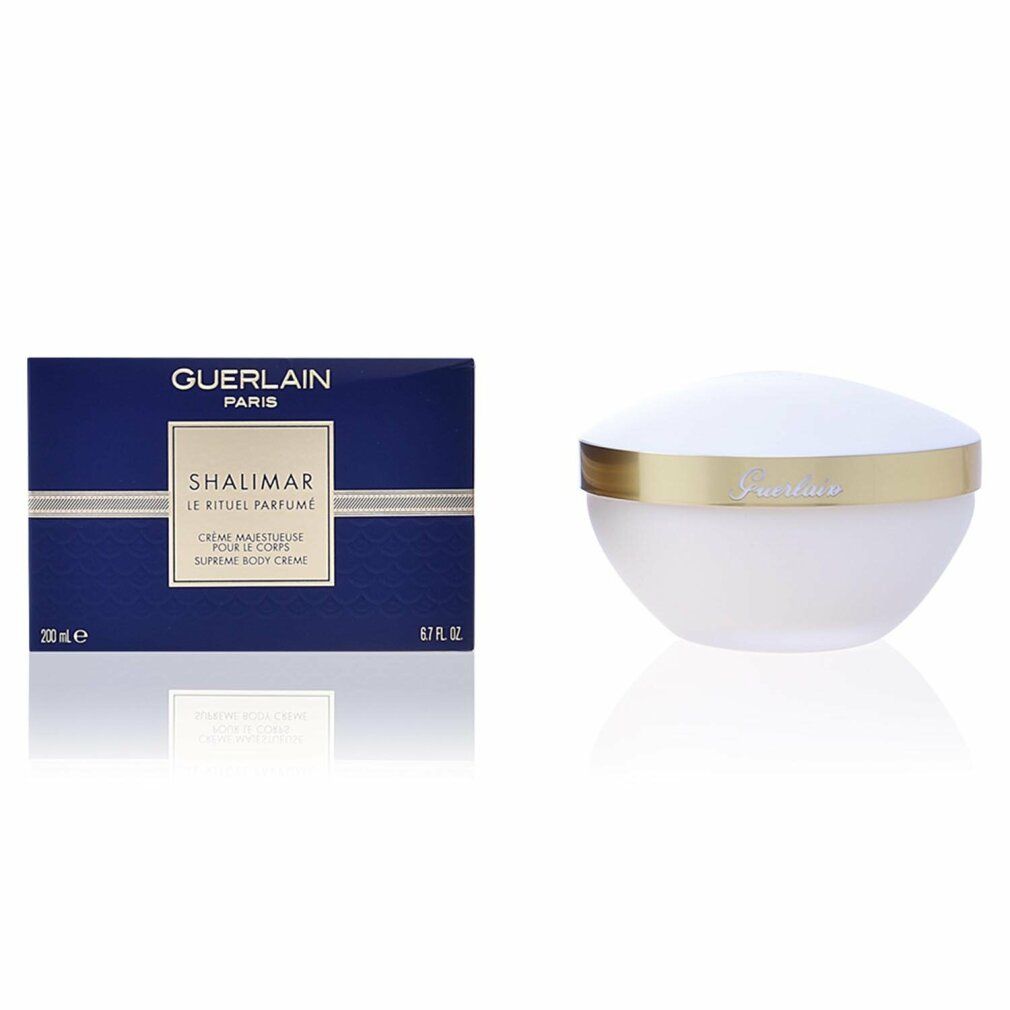 Blaue Schachtel mit Produktnamen und Logo. Weißer Tiegel mit goldenem Rand.