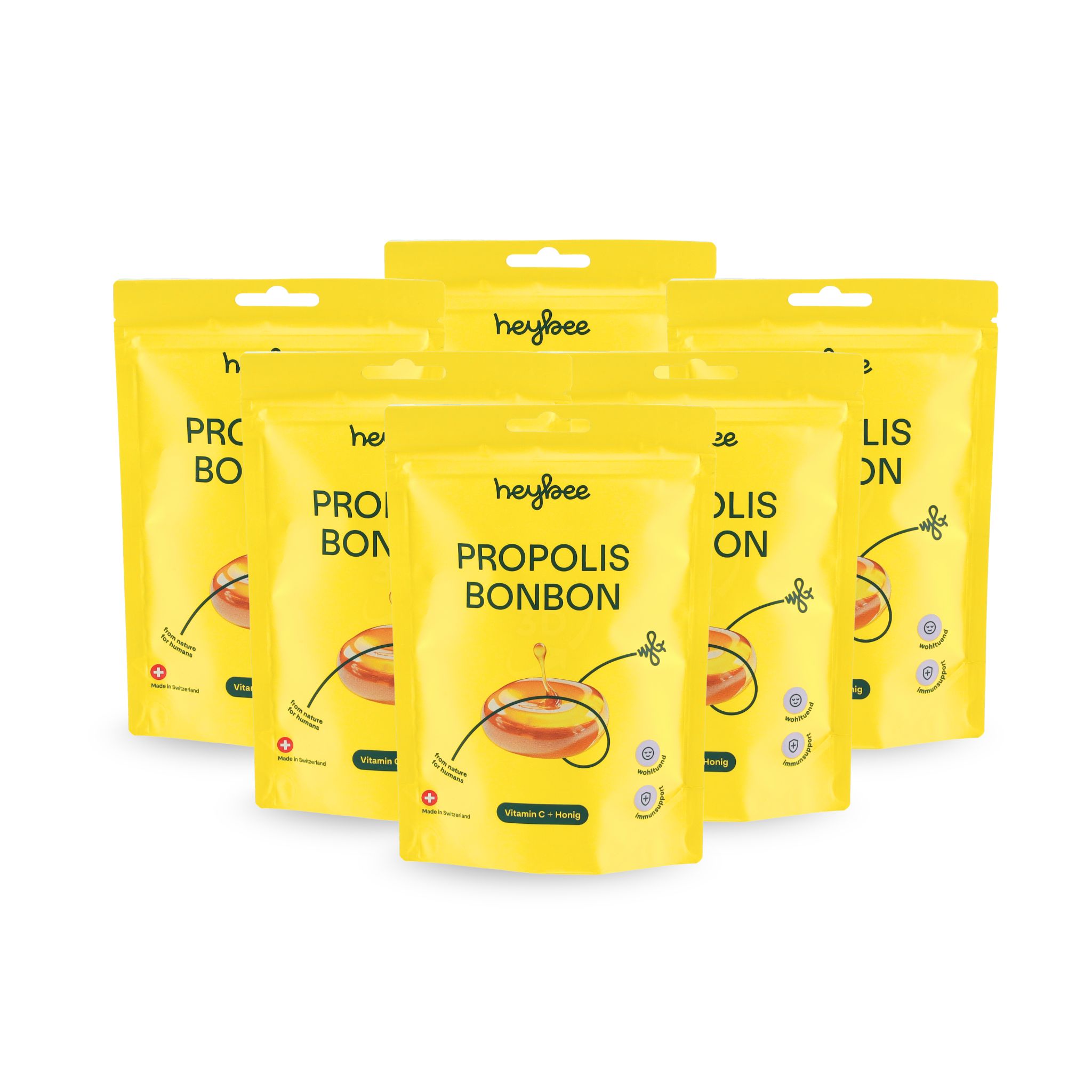 Sechs gelbe Verpackungen heybee Propolis Bonbon. Aufgereiht. Enthält Vitamin C und Honig. Für Hals und Rachen.