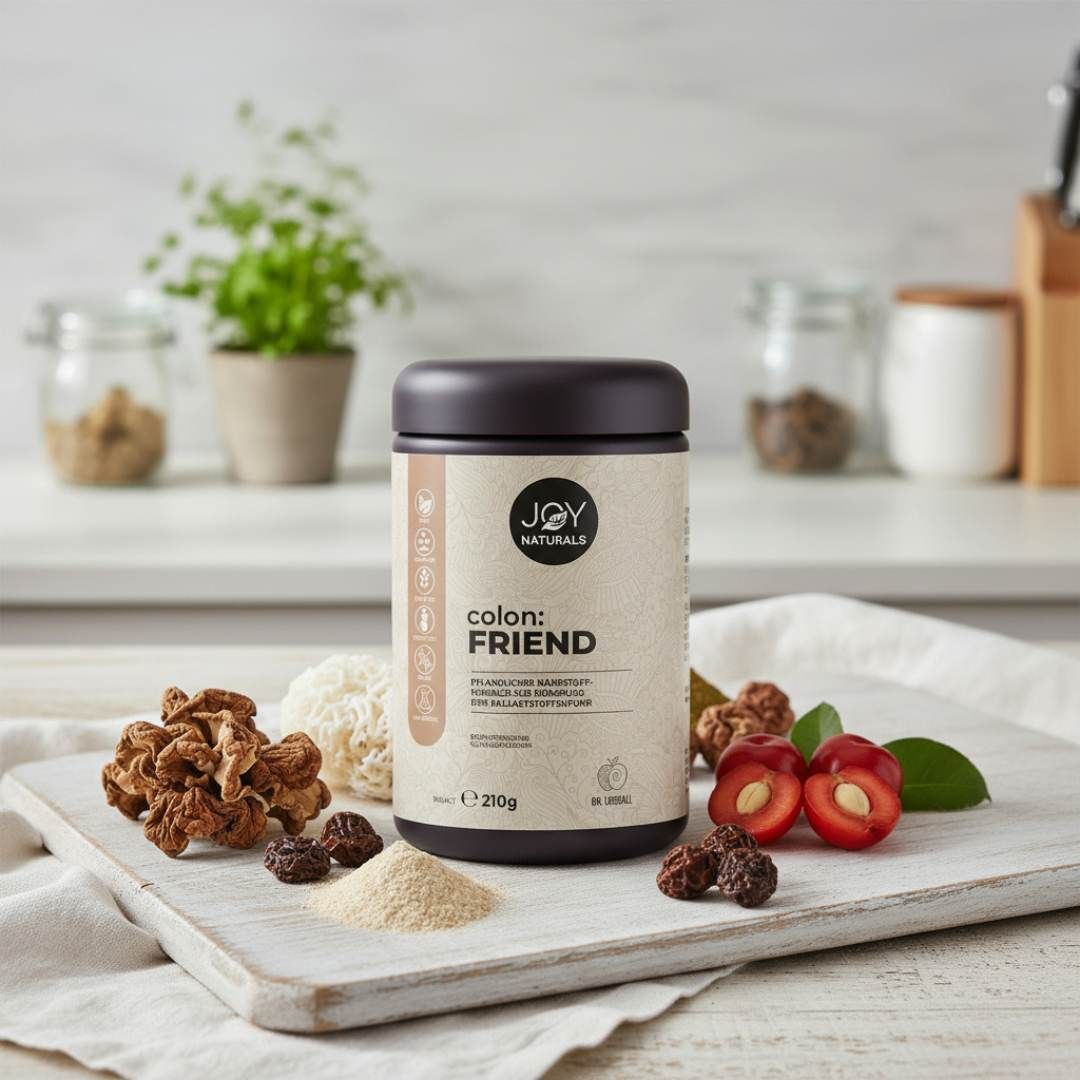 Dose JOY NATURALS colon:FRIEND. Braune Kappe, beiges Etikett. Auf Brett mit Früchten und Zutaten. 210g.