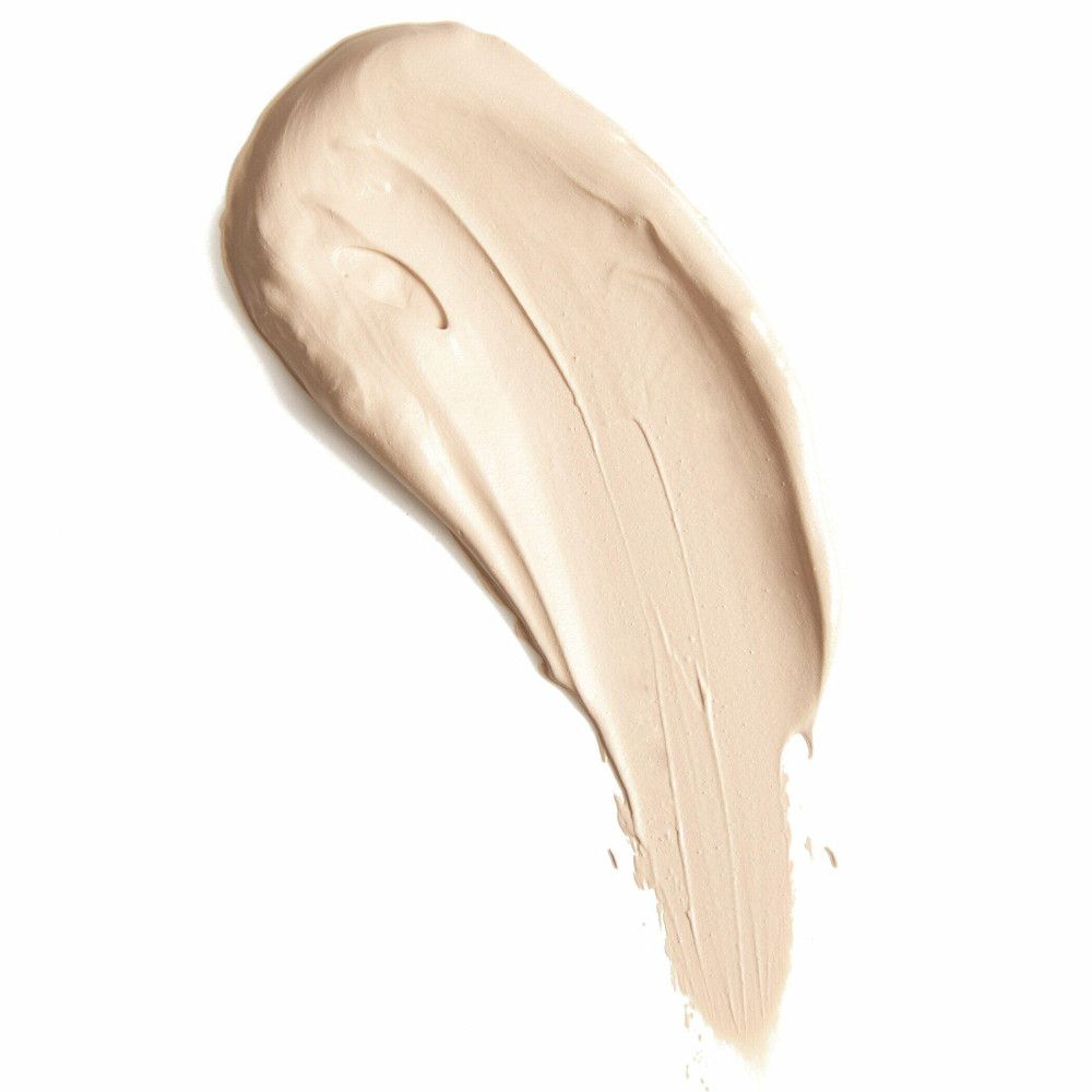 Heller Concealer-Farbton auf weißem Hintergrund. Textur mit sichtbaren Pinselstrichen.