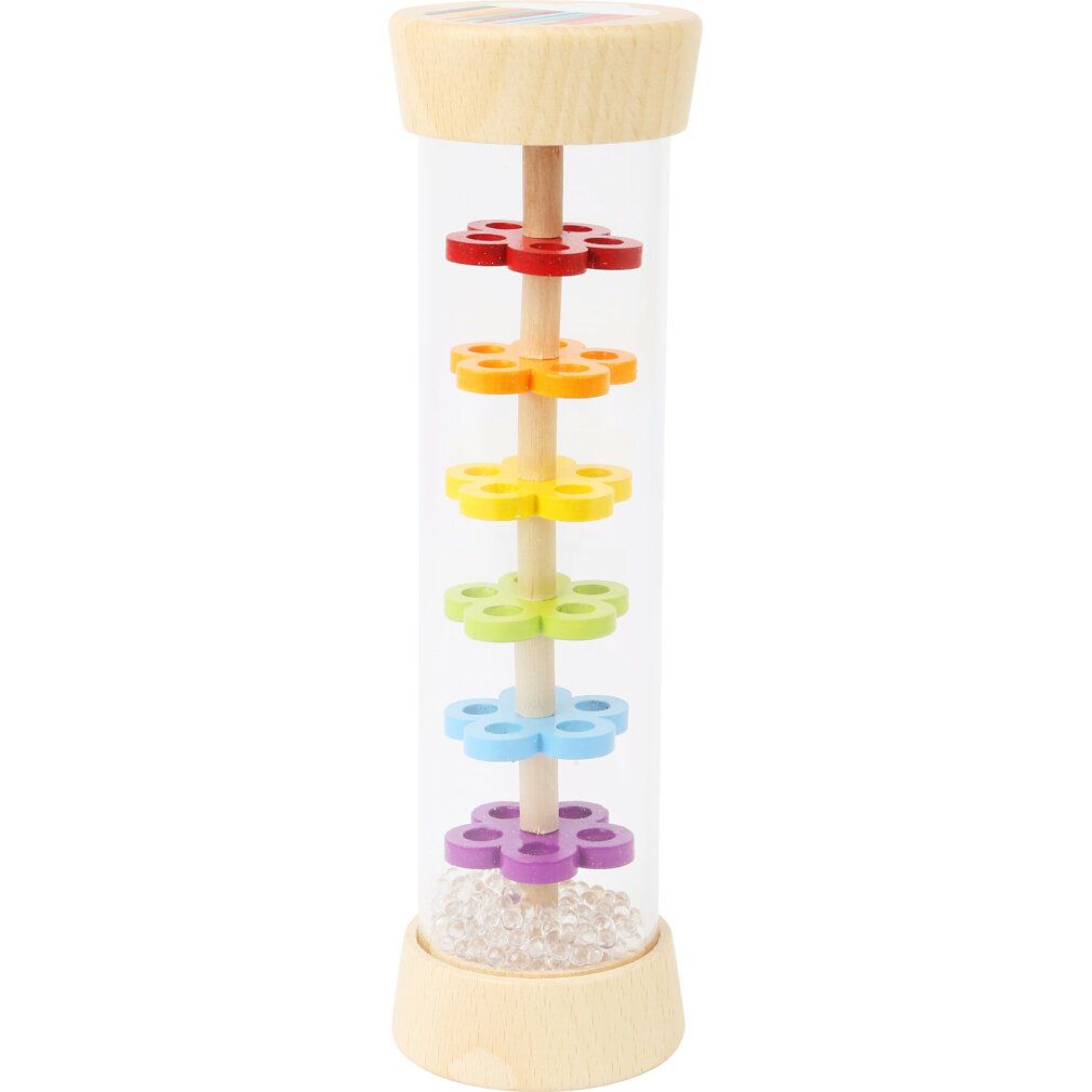 Zylindrisches Holzspielzeug mit farbigen Blütenblättern in einem transparenten Zylinder. Unten sind kleine Kugeln sichtbar.