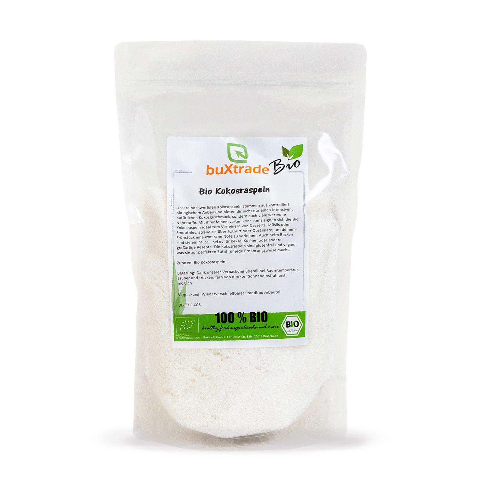 Transparente Verpackung mit buXtrade Bio Kokosraspeln. Produktansicht, Text und Bio-Siegel.