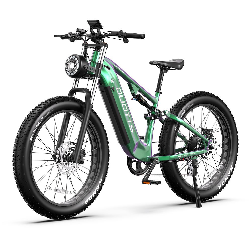 Grünes Elektro-Mountainbike mit breiten Reifen, DUOTTS-Logo, Scheinwerfer und Display.
