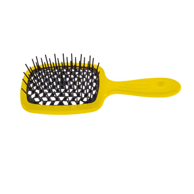 Gelb-schwarze Haarbürste. Rechteckiger Bürstenkopf mit schwarzen Borsten, gelber Griff.