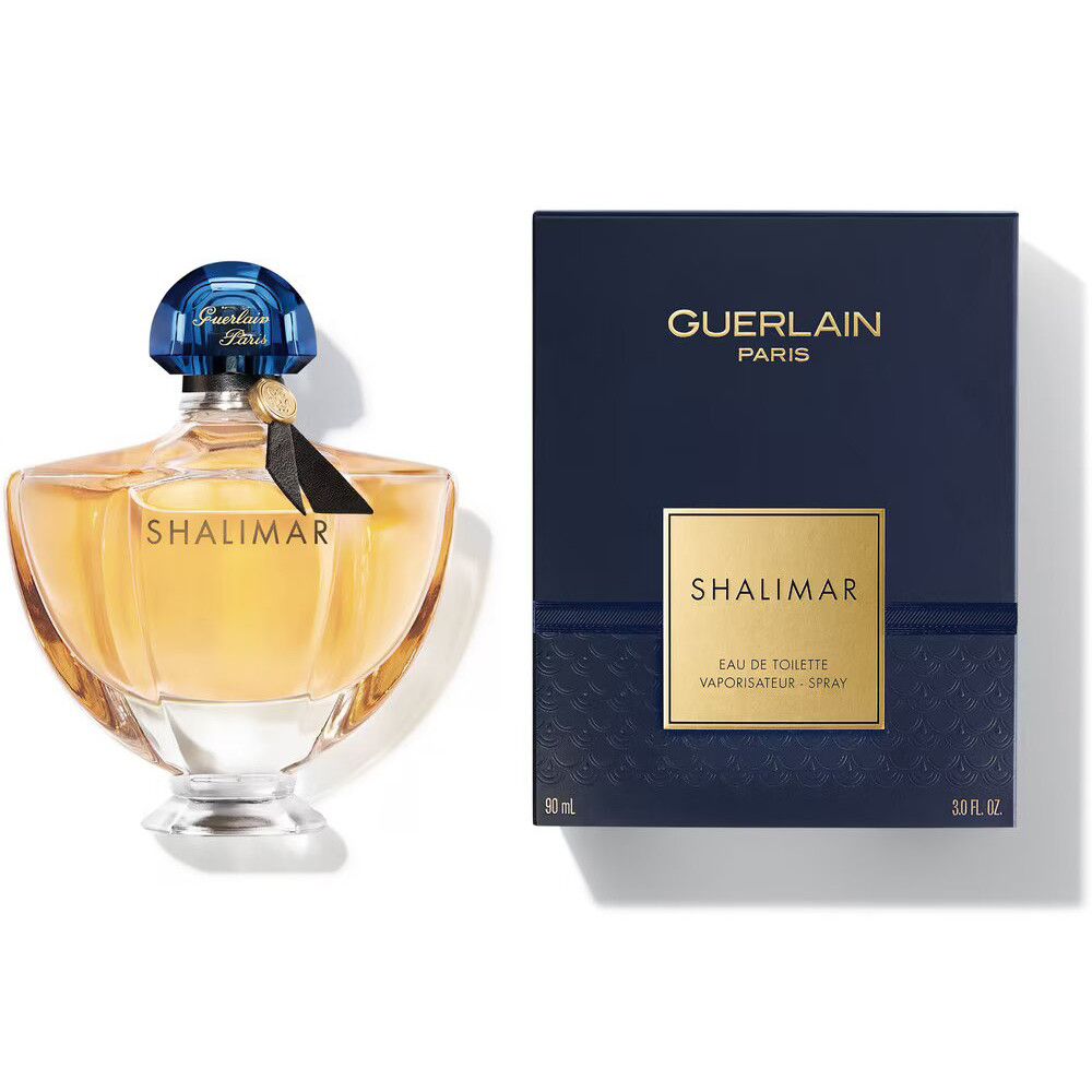 Guerlain Shalimar Flakon und Verpackung. Blau-goldene Farbgebung. Aufschrift Shalimar und Guerlain Paris.