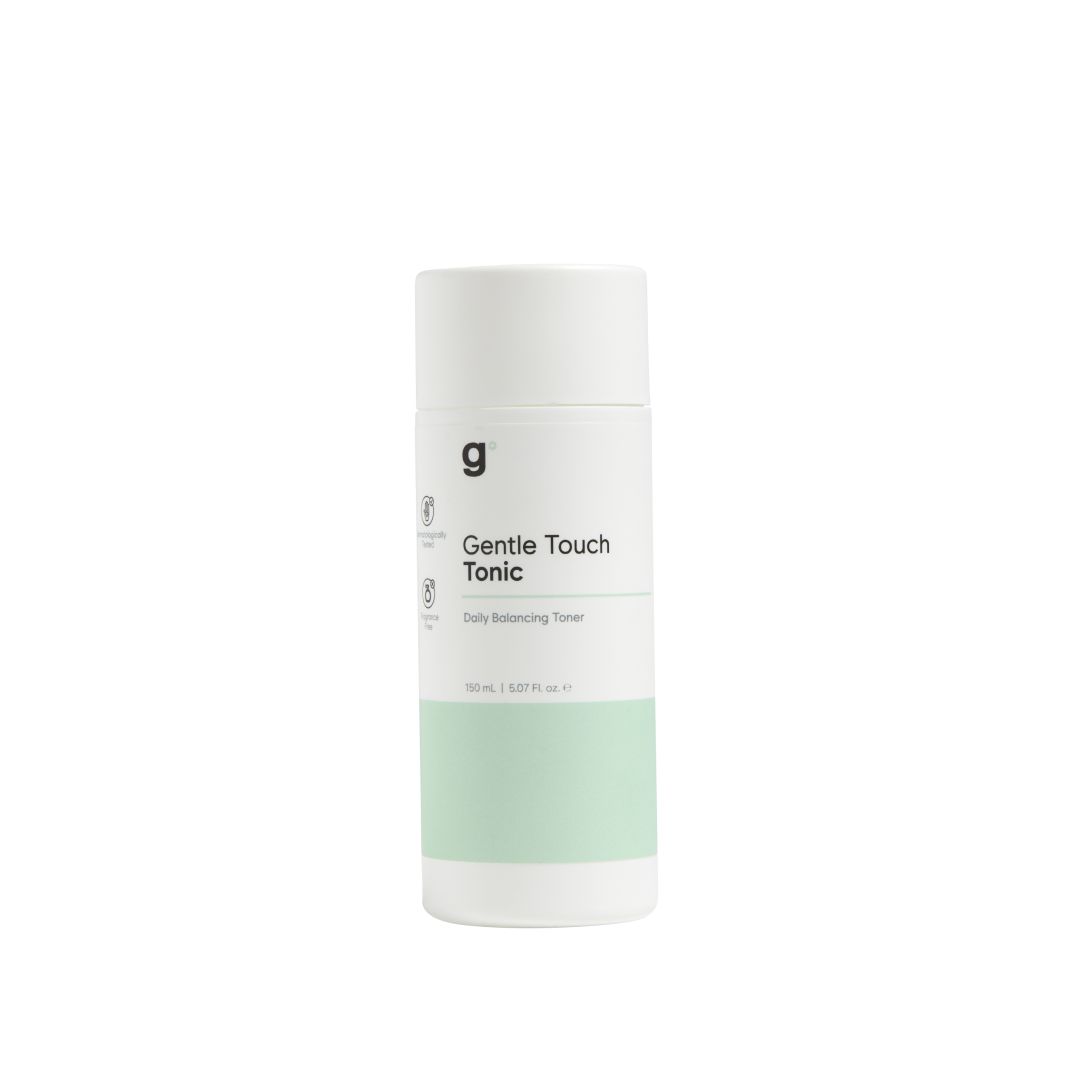 Zylindrische Flasche mit grünem Band. Aufschrift: Gentle Touch Tonic. Logo 'g'.