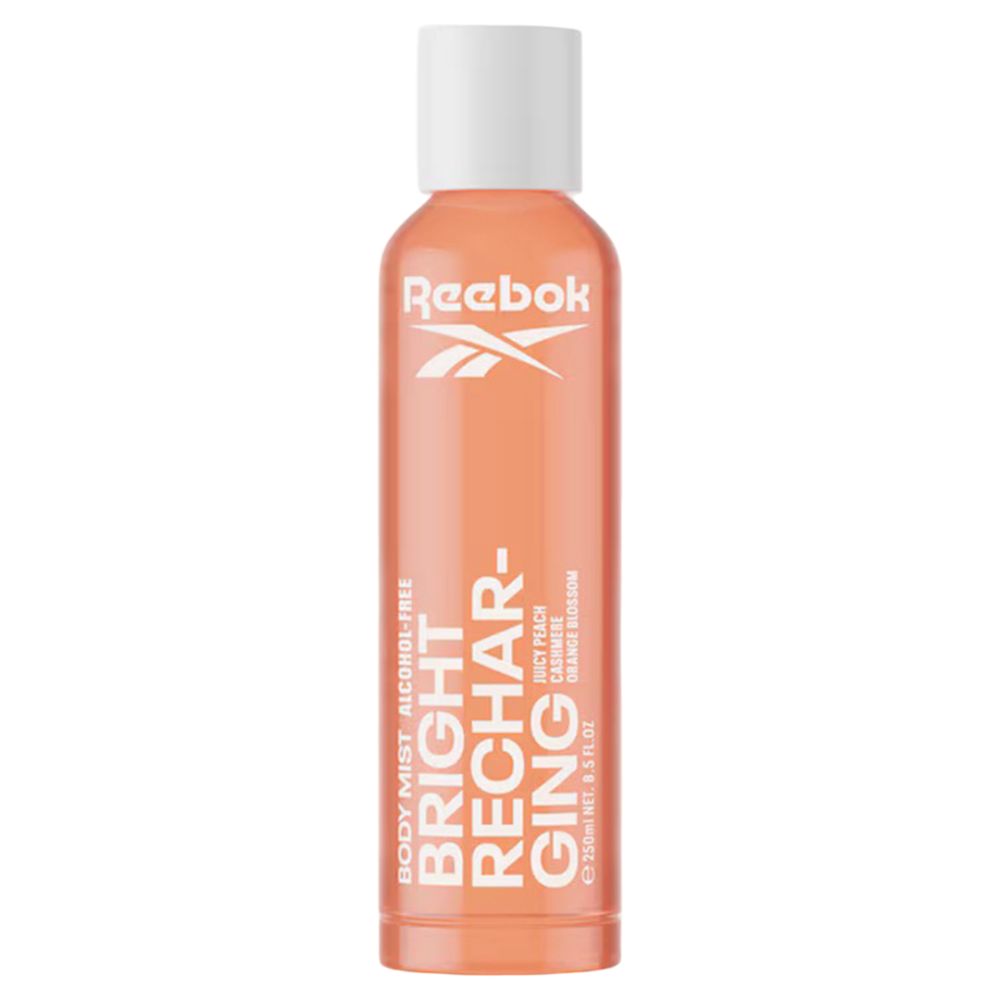 Orangefarbene Flasche mit weißem Deckel. Text: Reebok, Bright Recharging, Alcohol Free. Duft: Juicy Peach, Cashmere, Orange Blossom.