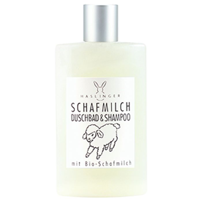 Flasche mit Etikett. Aufschrift: Schafmilch Duschbad & Shampoo. Logo: Hase. Zeichnung: Schaf. Text: mit Bio-Schafmilch.