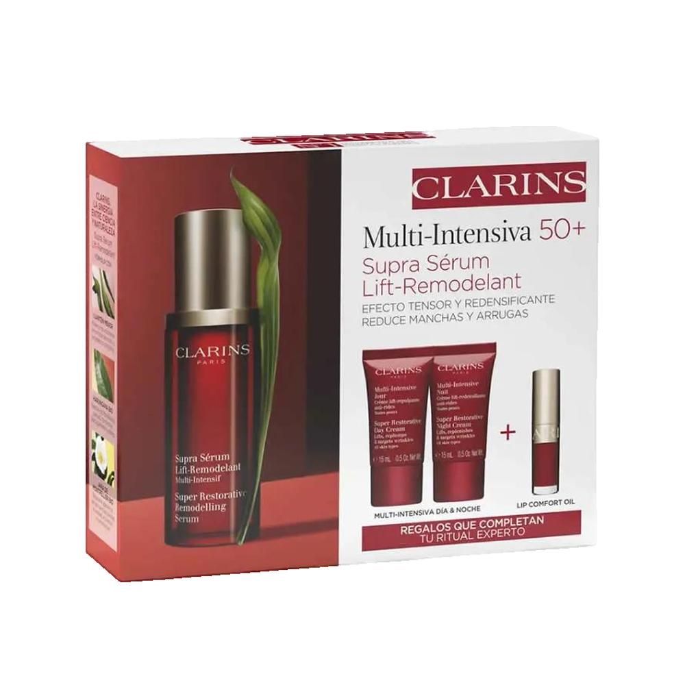 Geschenkset mit Serum und weiteren Produkten. Rote und weiße Verpackung mit Produktnamen und Marke CLARINS. Enthält Serum, Cremes und Lippenöl.