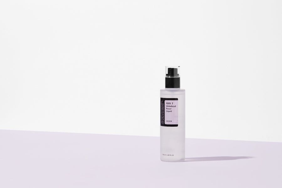 AHA 7 Whitehead Power Liquid Flasche. Transparente Flasche mit schwarzem Deckel und Etikett.