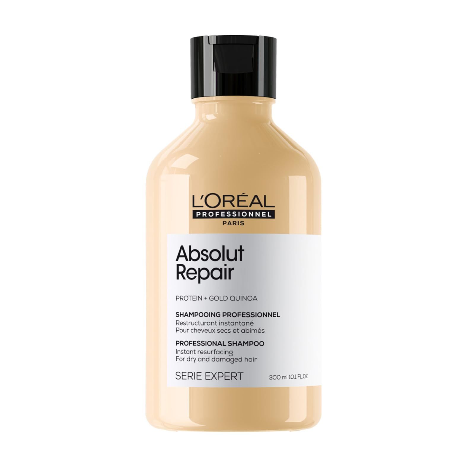Beige Shampoo-Flasche mit schwarzem Deckel. L'Oréal Professionnel Absolut Repair. Text auf Etikett.