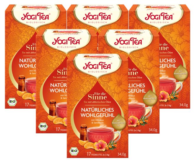 Mehrere Packungen Yogi Tea Kräutertee. Orangefarbene Verpackung mit Logo und Produktbezeichnung. Bio-Siegel.