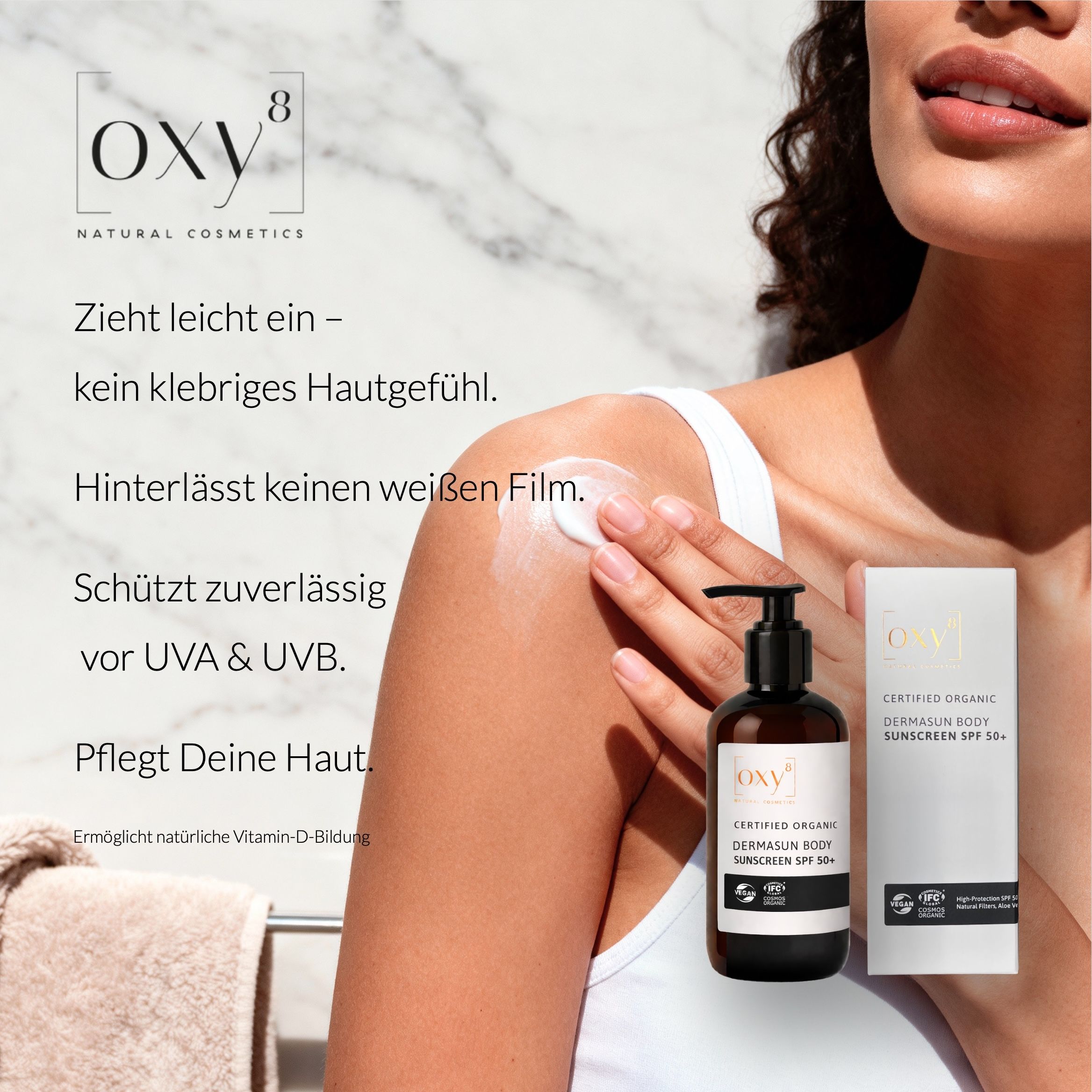 Frau trägt Sonnencreme auf. Text: Zieht leicht ein – kein klebriges Hautgefühl.
