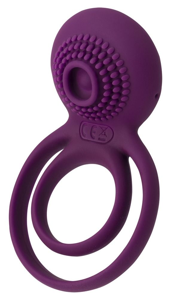 Lila Penisring mit zwei Ringen und Stimulator. Oberteil mit Noppen und CE-Kennzeichnung. Sichtbare Öffnung.