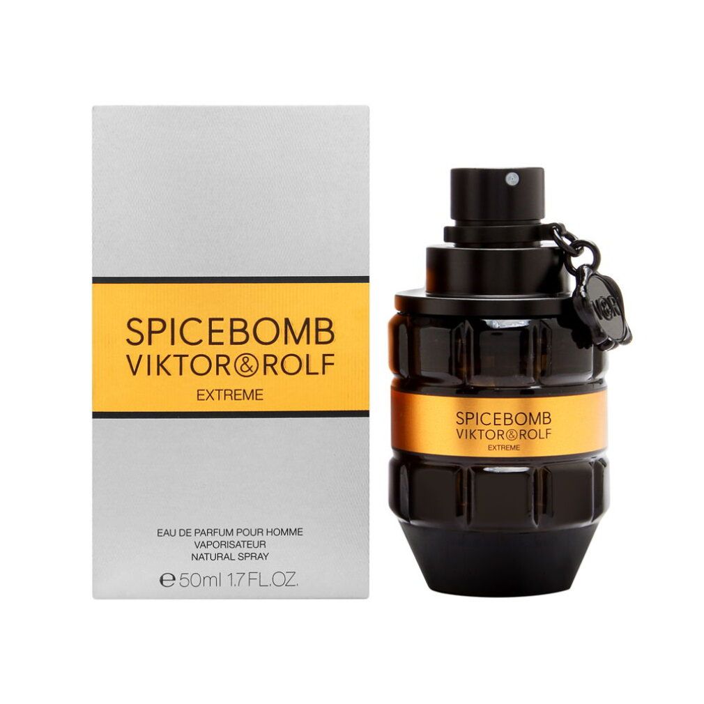 Schwarzer Flakon mit goldfarbenem Band. Aufschrift: SPICEBOMB VIKTOR&ROLF EXTREME. Graue Verpackung daneben.