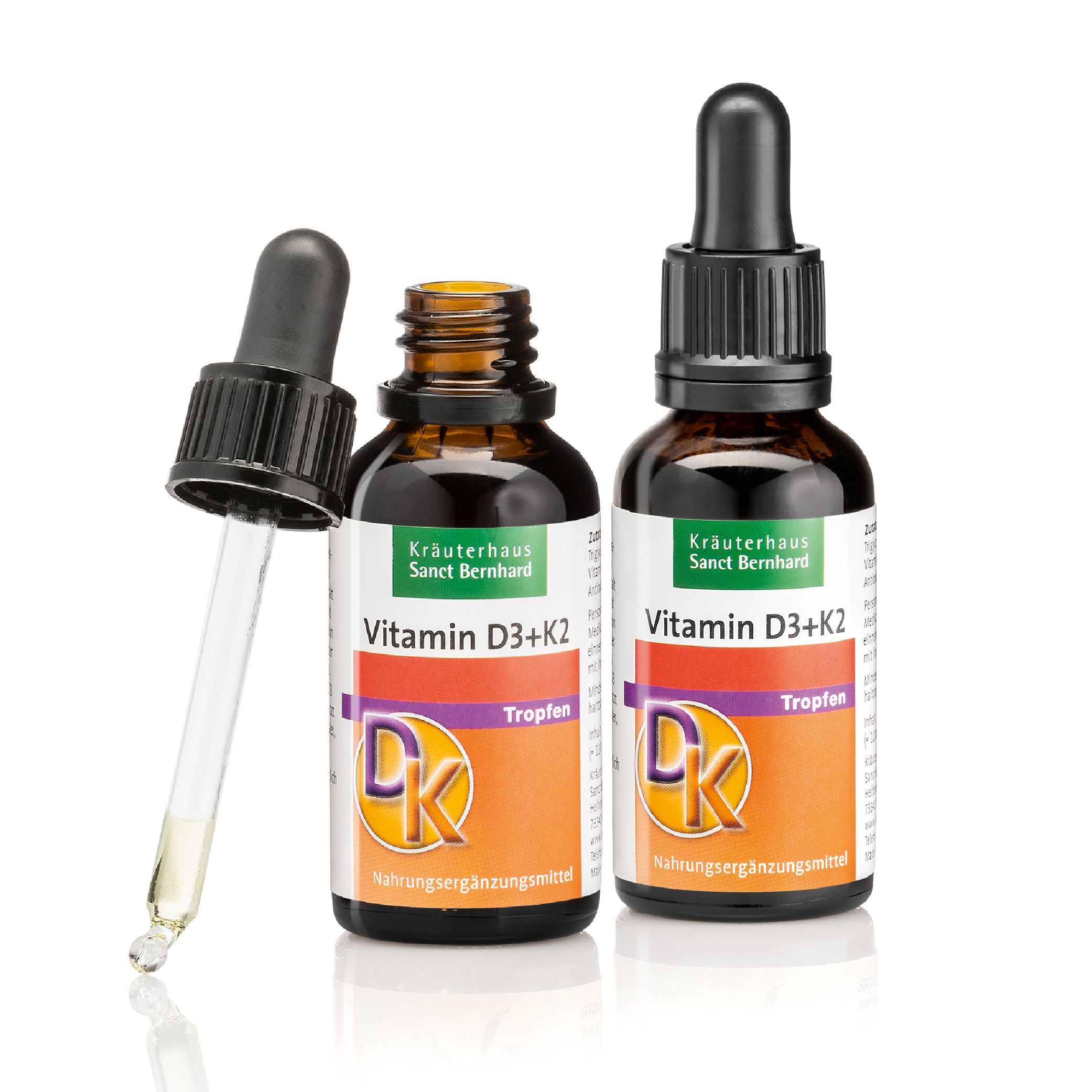 Zwei Flaschen Vitamin D3+K2-Tropfen mit Pipette. Marke: Kräuterhaus Sanct Bernhard. Etikett mit Produktnamen und DK-Logo.