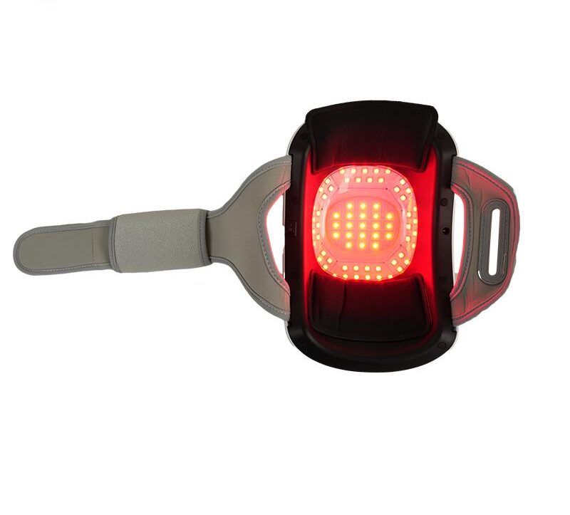 Kniebandage mit rotem Lichtfeld. Graues Band mit Klettverschluss. Rechteckige Form.