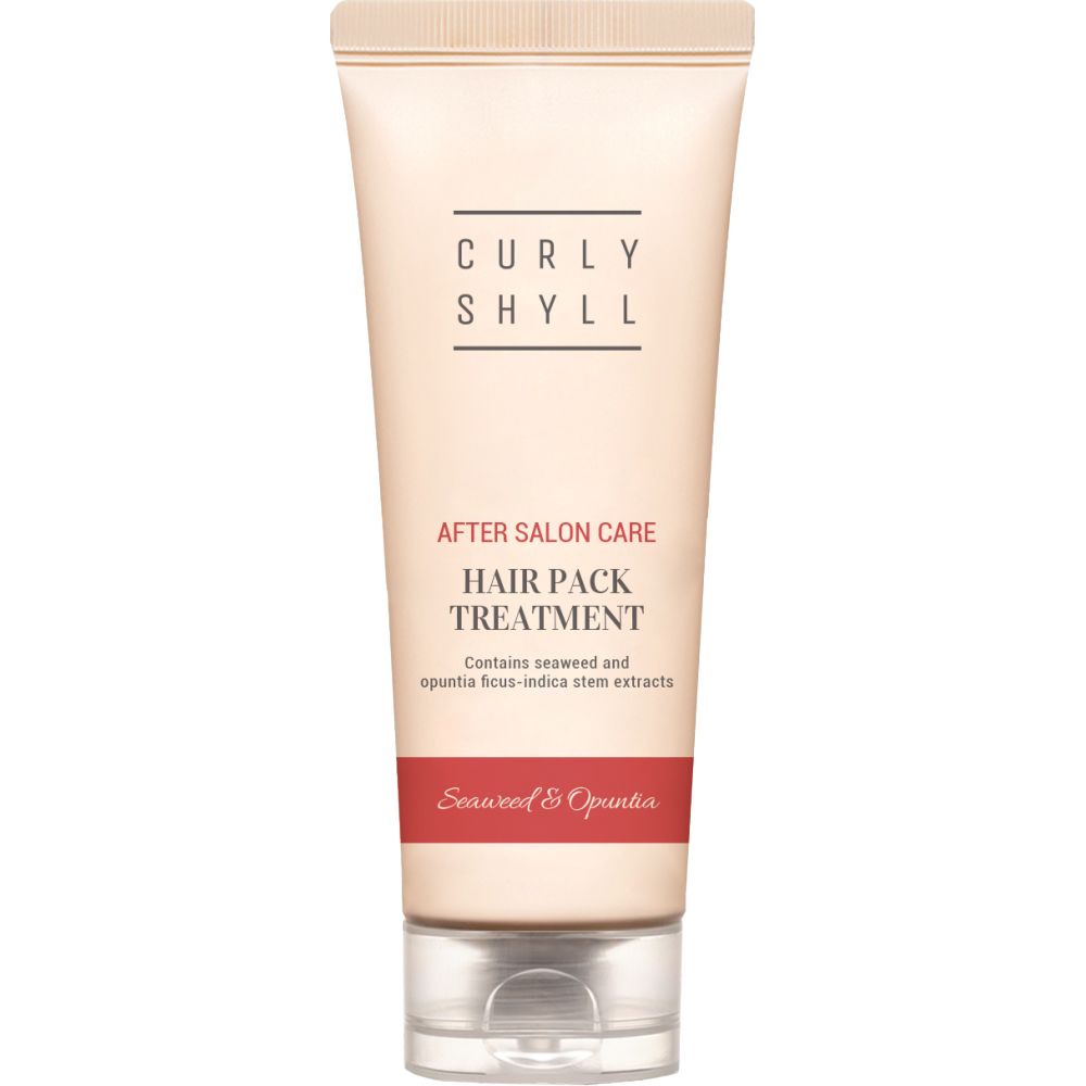 Beige Tube mit Text. Aufschrift: CURLY SHYLL, After Salon Care, Hair Pack Treatment. Roter Streifen mit Text: Seaweed & Opuntia.