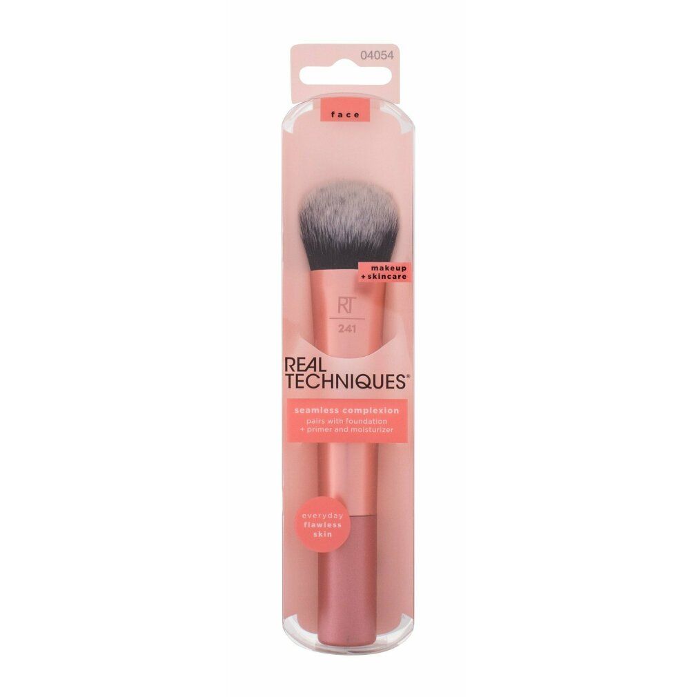 Make-up Pinsel in Verpackung. Rosa Griff, grau-schwarze Borsten. Auf der Verpackung steht "REAL TECHNIQUES".