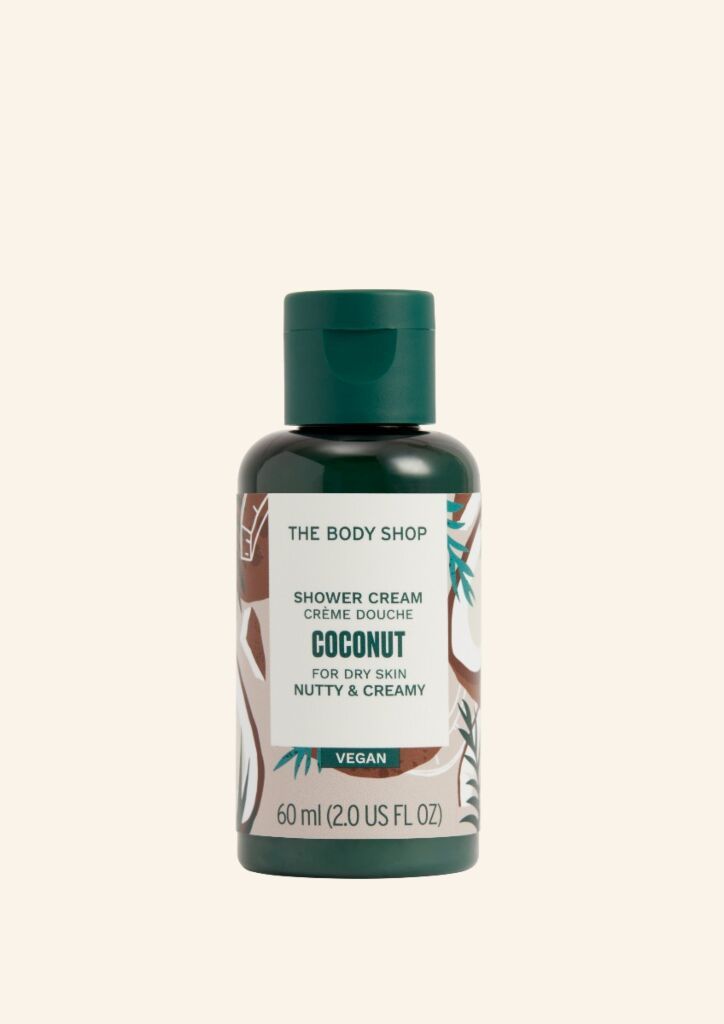 Kleine grüne Flasche mit "Coconut Shower Cream". Vegan. 60 ml.
