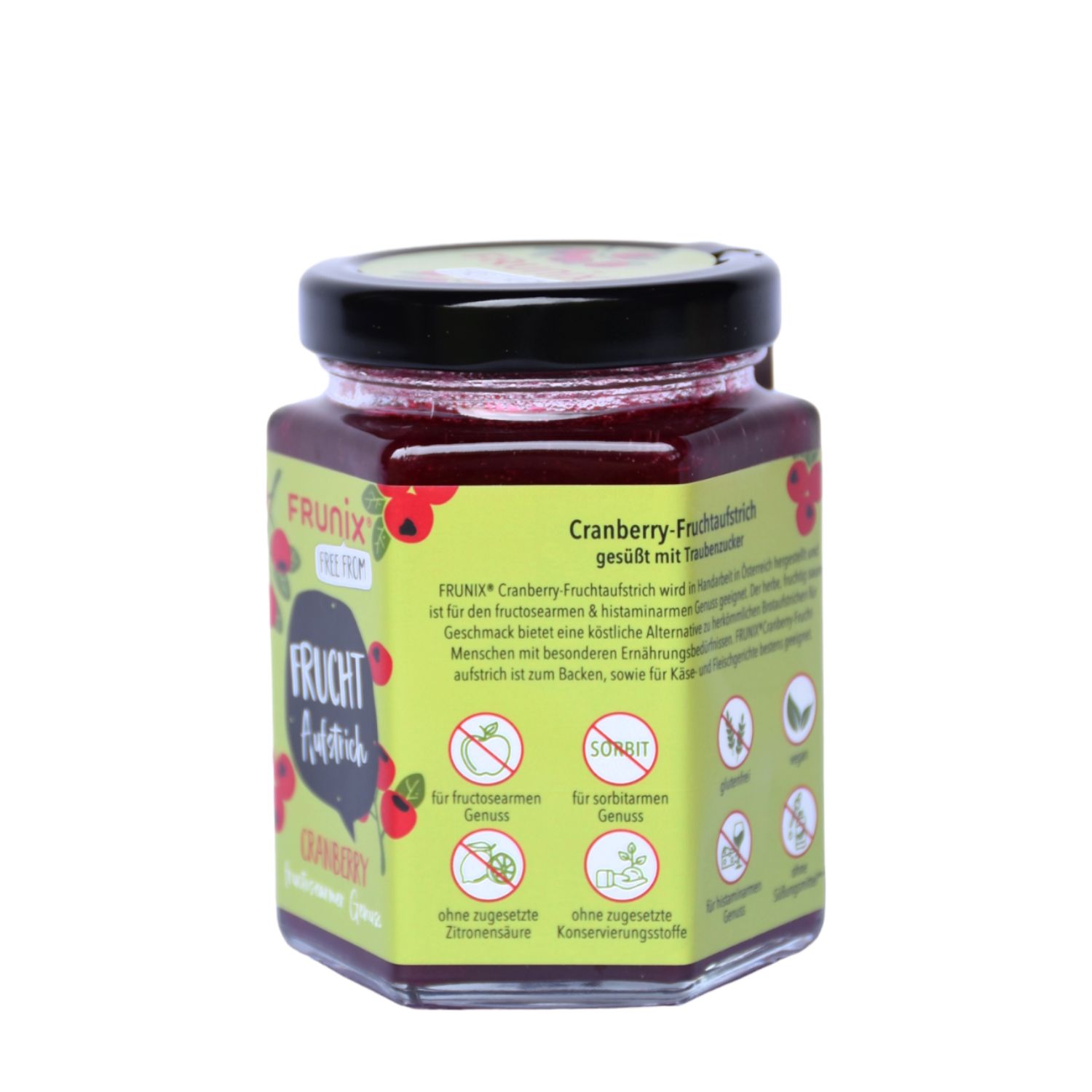 Glas mit Cranberry-Fruchtaufstrich. Aufschrift: FRUNIX Fruchtaufstrich Cranberry. Grün-gelbes Etikett mit Informationen und Logos.
