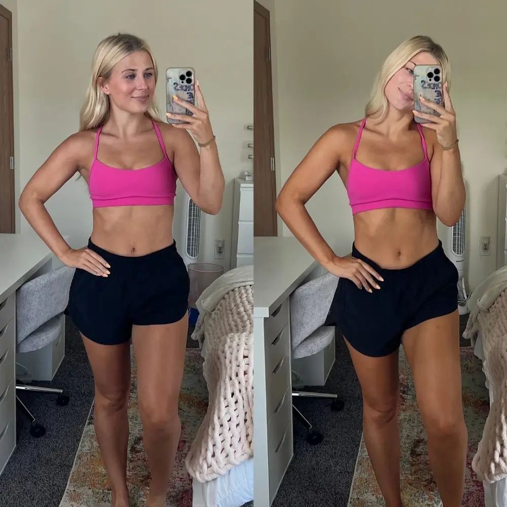 Frau in pinkem Sport-BH und schwarzen Shorts.