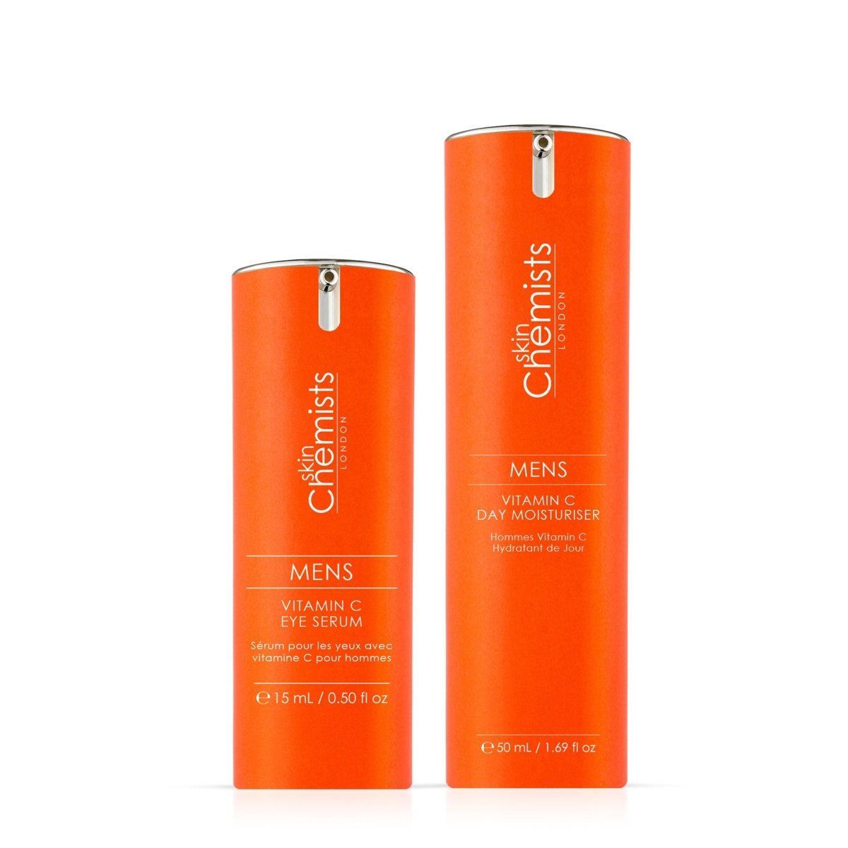 Zwei orangefarbene Pumpspender mit 'skinChemists LONDON MENS VITAMIN C EYE SERUM' und 'VITAMIN C DAY MOISTURISER'.