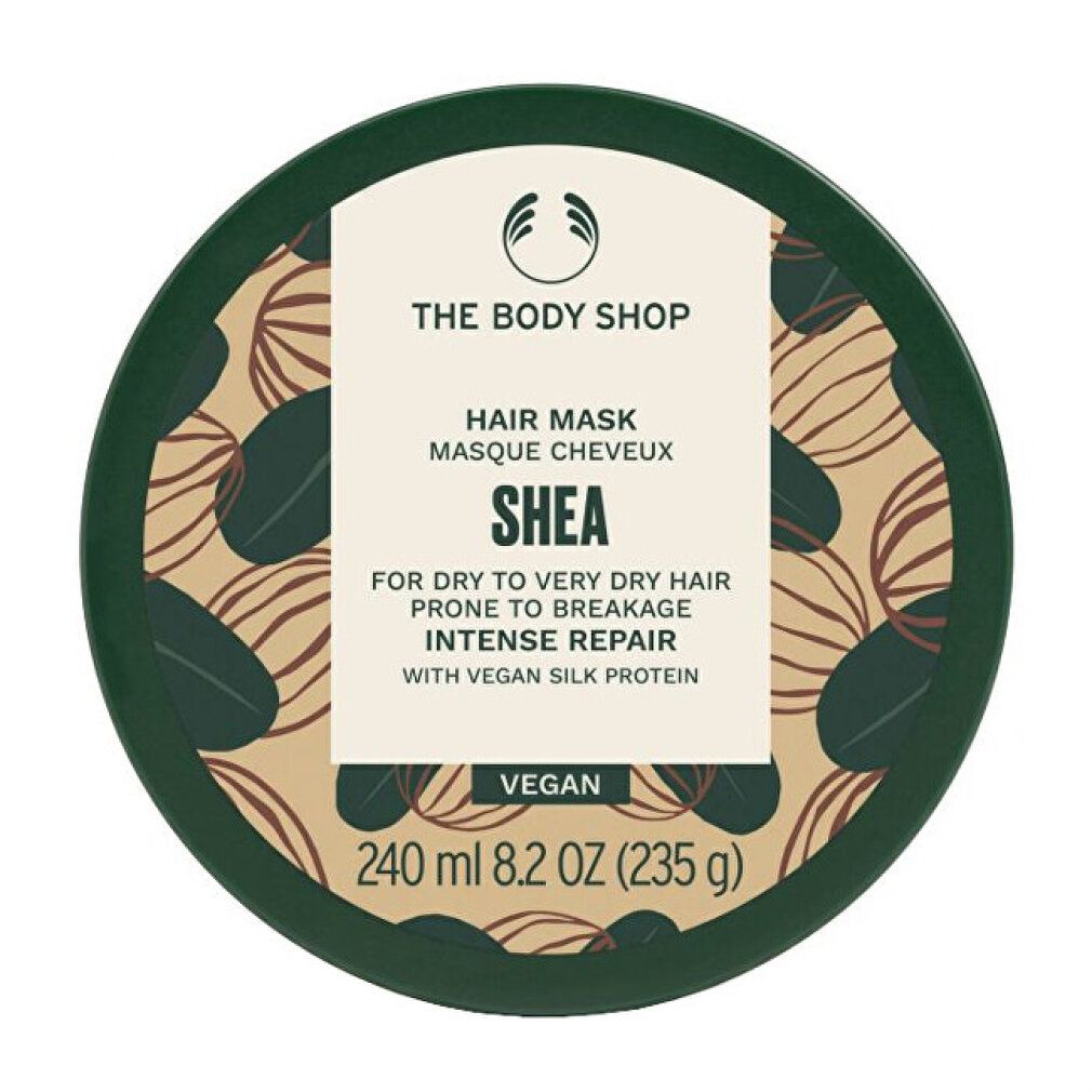 Runde, grüne Dose mit SHEA Hair Mask. Enthält 240 ml. Vegan. The Body Shop Logo. Aufschrift: Intense Repair.