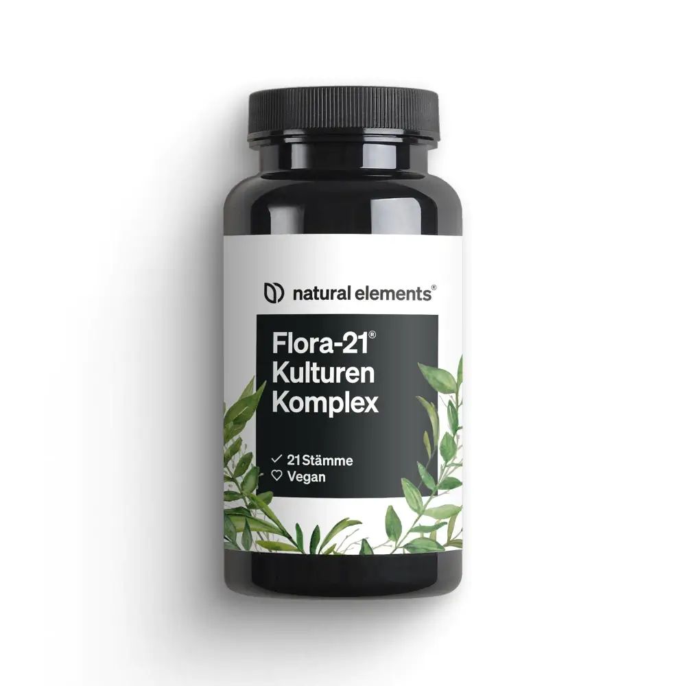 Schwarze Flasche mit weißem Etikett. Aufschrift: Flora-21 Kulturen Komplex, 21 Stämme, Vegan. Grüne Blätter.