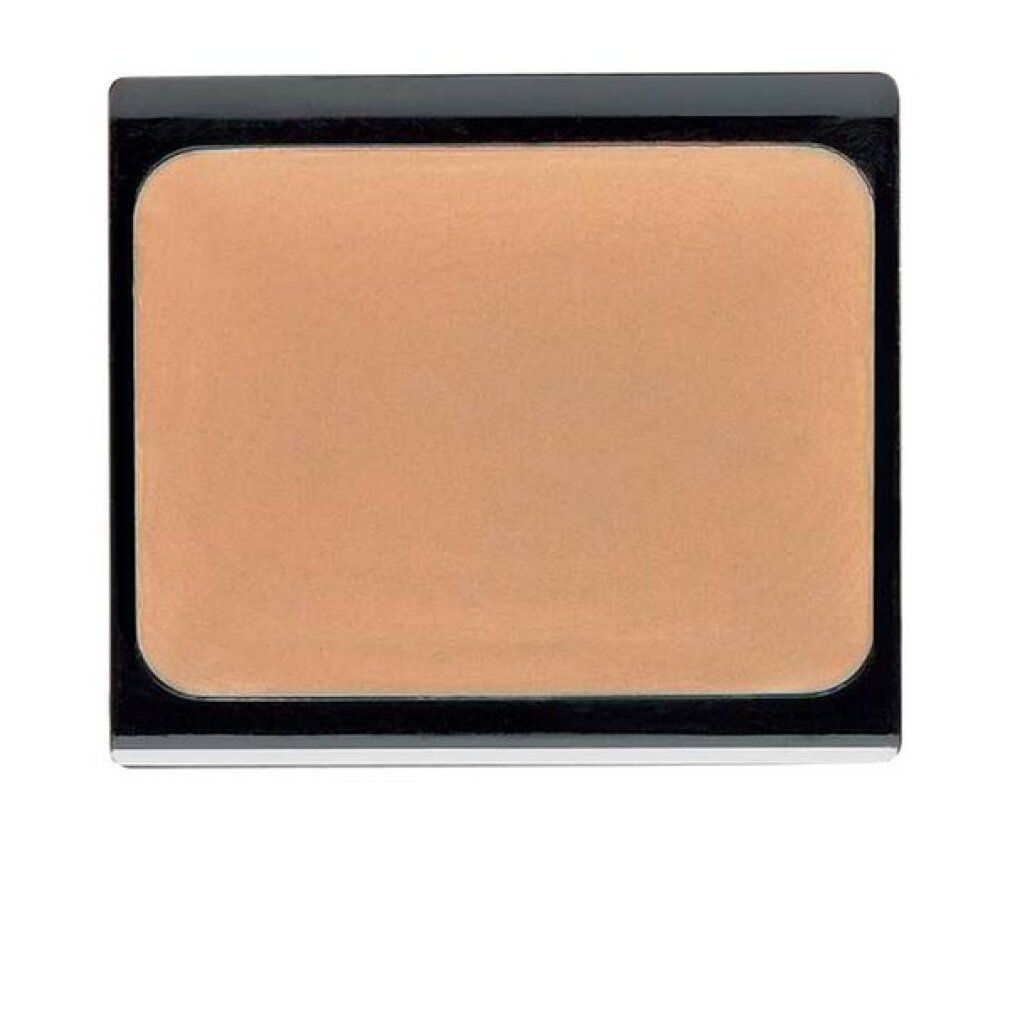 Kompakte, beige-apricotfarbene Camouflage-Creme in einer rechteckigen, schwarzen Kompaktverpackung.