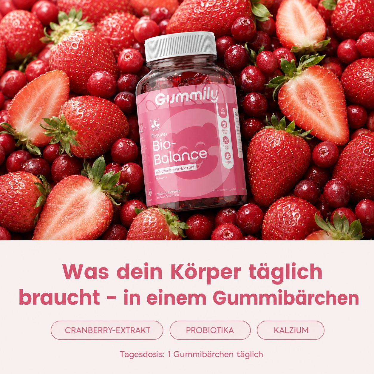 Gummily Bio-Balance Flasche inmitten von Erdbeeren und Cranberries.