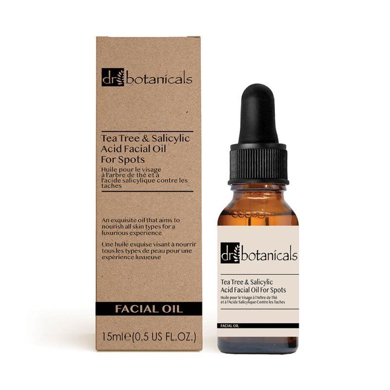 Dr. Botanicals Gesichtsöl mit Teebaumöl und Salicylsäure in Braunglasflasche mit Pipette und Umverpackung.