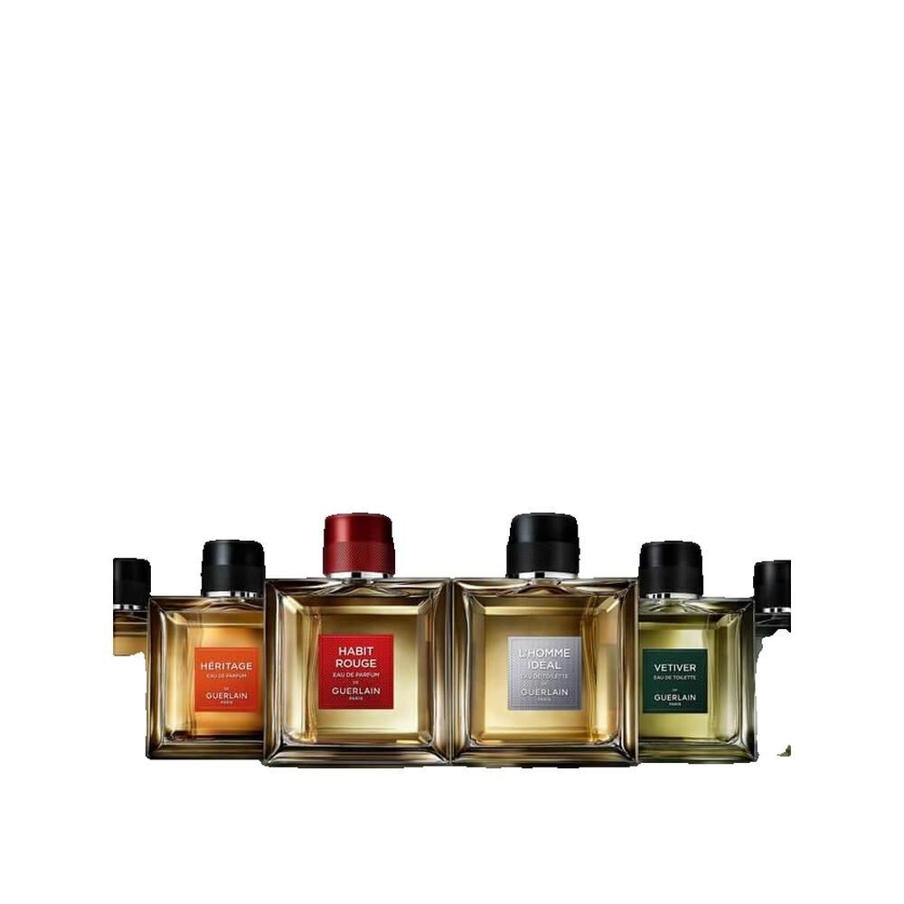 Vier Flakons Eau de Parfum. Héritage, Habit Rouge, L'Homme Idéal und Vétiver. Quadratische Flakons mit farbigen Etiketten.