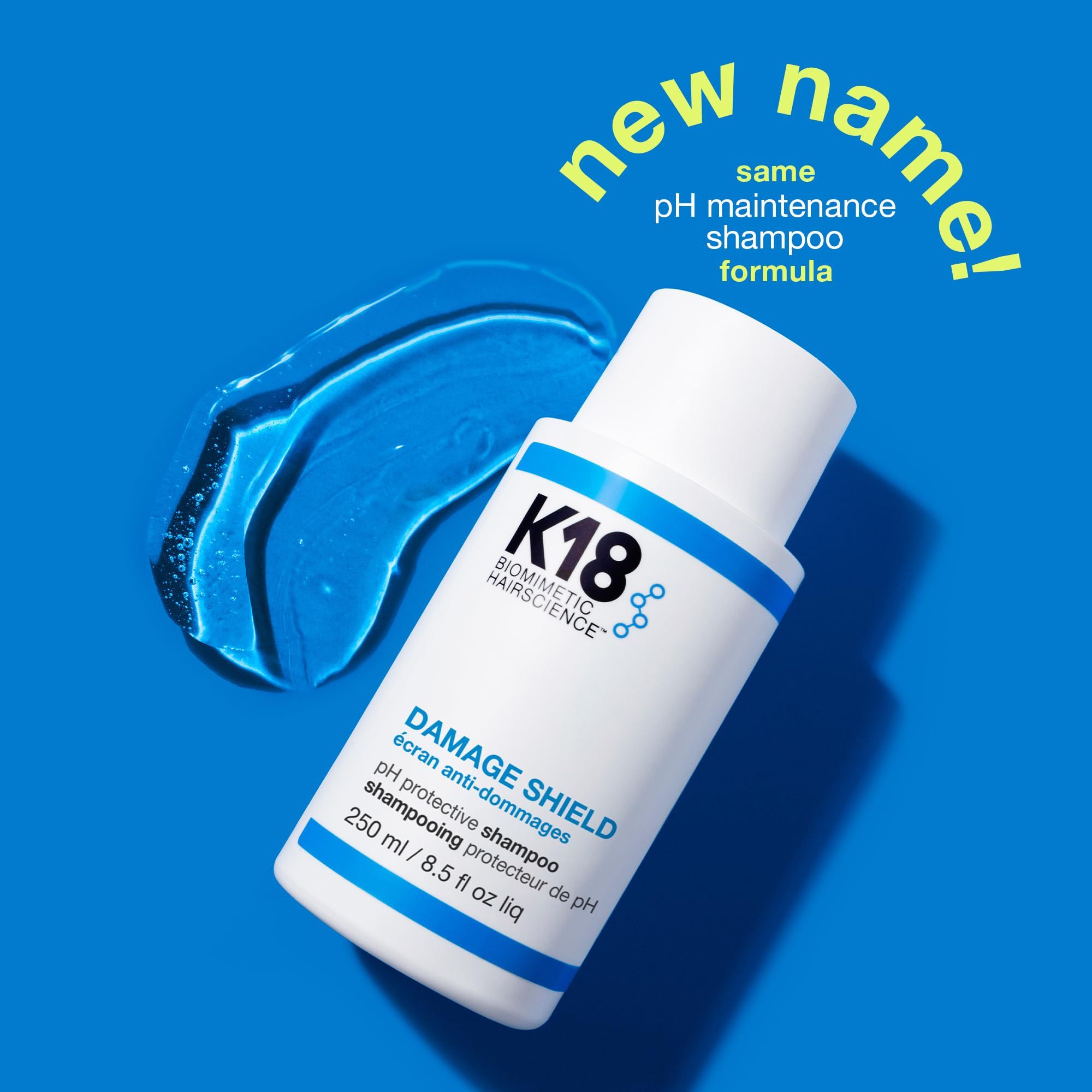 K18 Damage Shield Shampoo Flasche neben einem blauen Gelklecks.