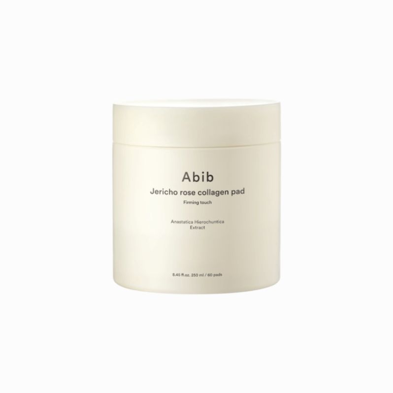 Zylindrische, cremefarbene Dose. Text: „Abib Jericho rose collagen pad“ und weitere Informationen.