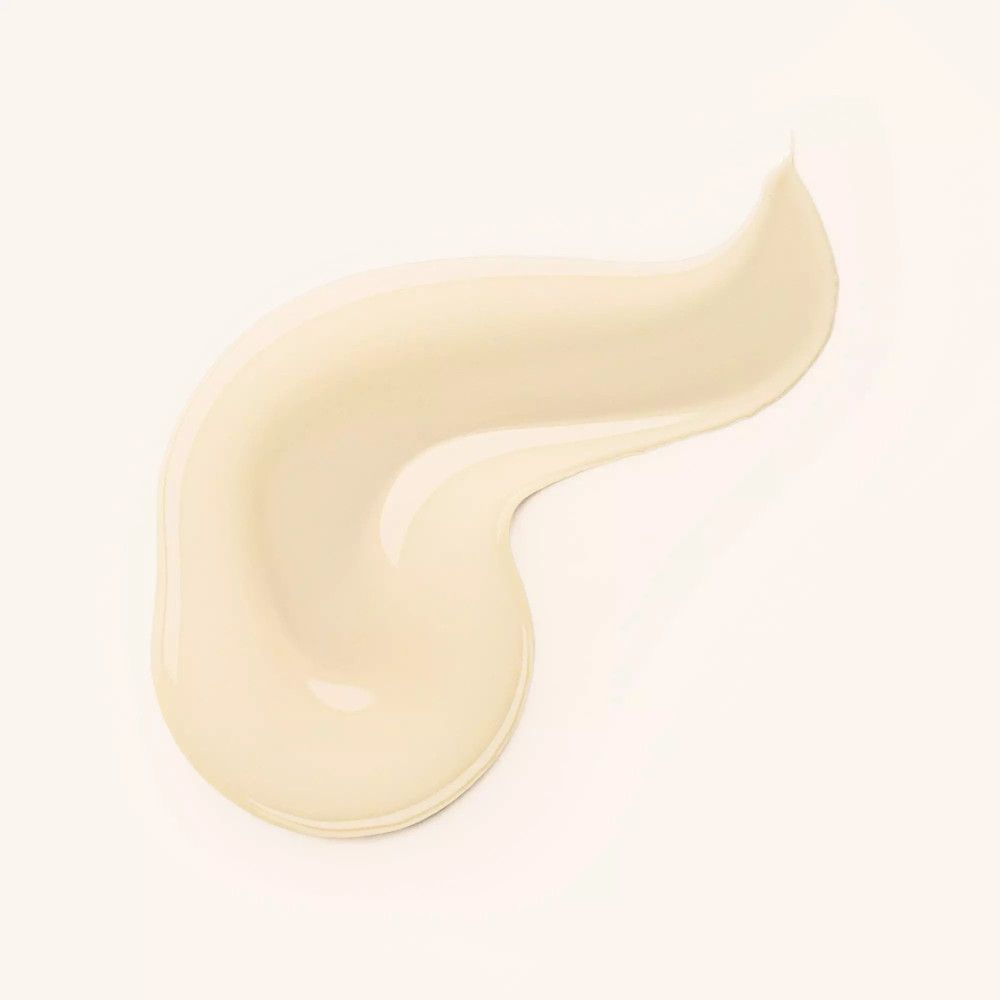 Ausgestrichenes Serum. Cremefarbene, wellenförmige Spur. Auf hellem Hintergrund.