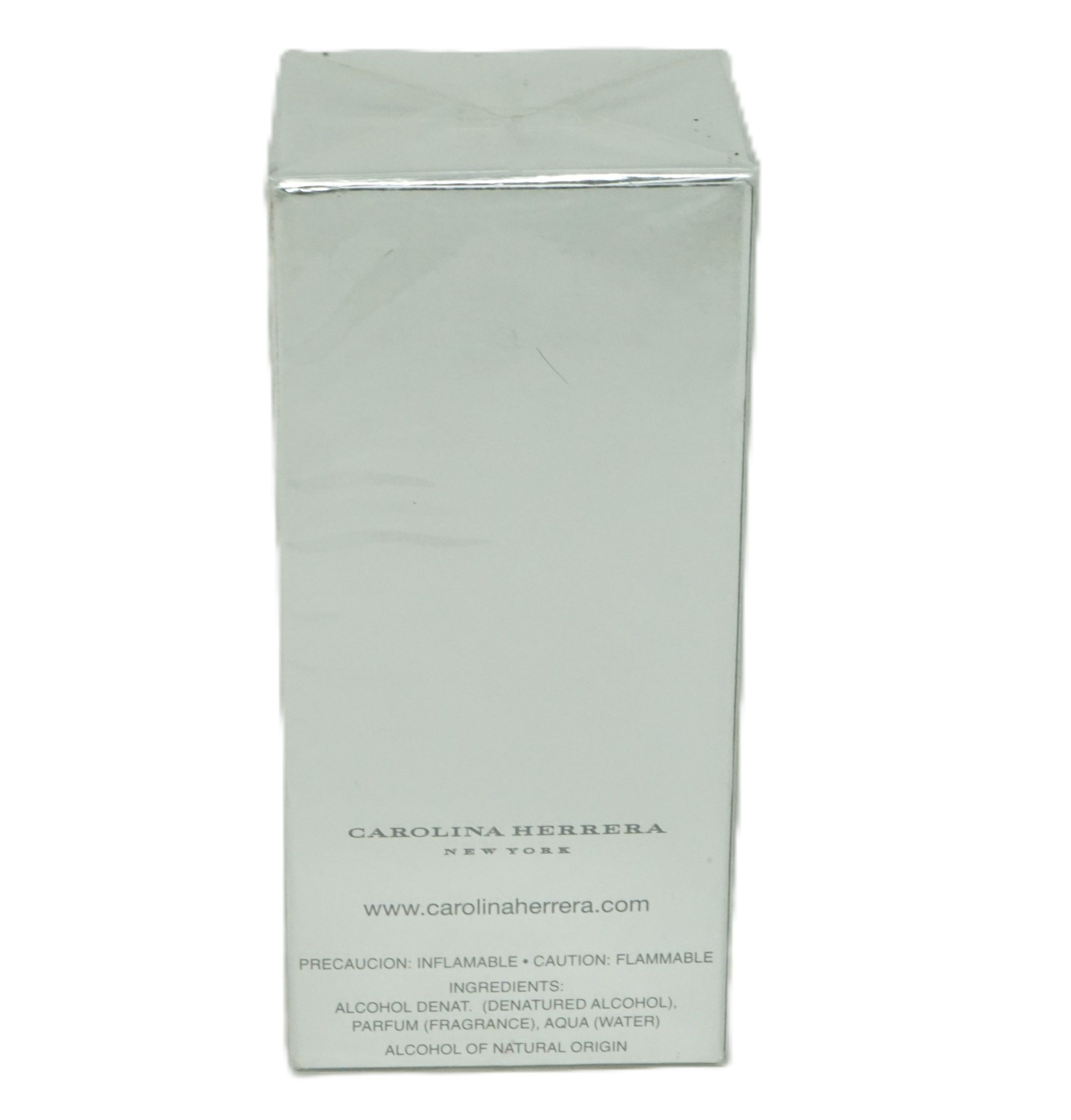 Rechteckige, silberfarbene Verpackung. Aufschrift: Carolina Herrera New York. Text: Vorsicht, brennbar. Inhaltsstoffe: Alkohol, Wasser.